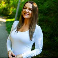 Stephanie Gilstrap standing on campus at the University of Georgia.